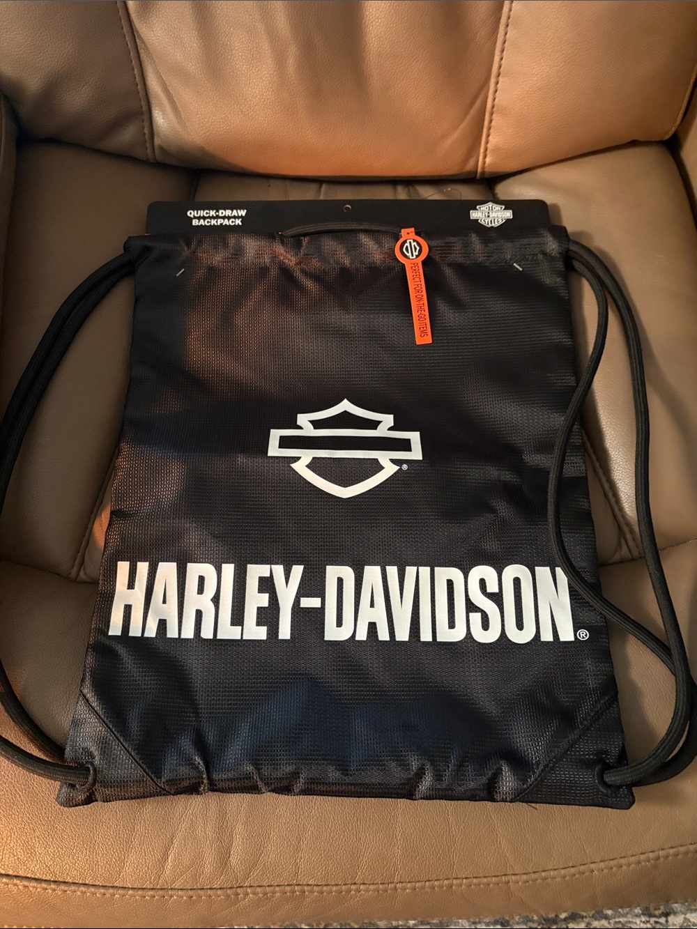 Harley-Davidson Black Drawstring Backpack with White Logo and Orange Tag